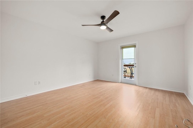 spare room featuring light wood-type flooring and ceiling fan