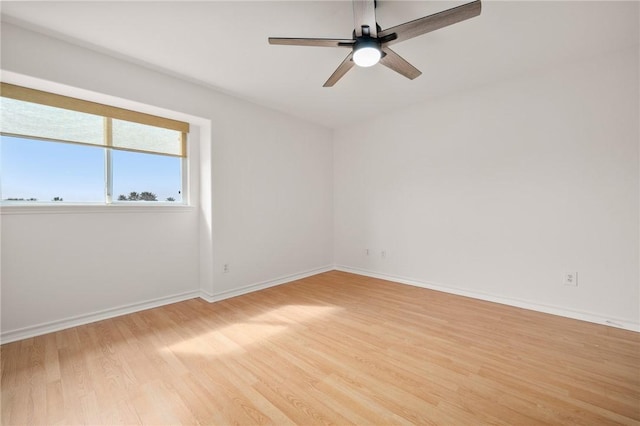 empty room featuring ceiling fan and light hardwood / wood-style floors