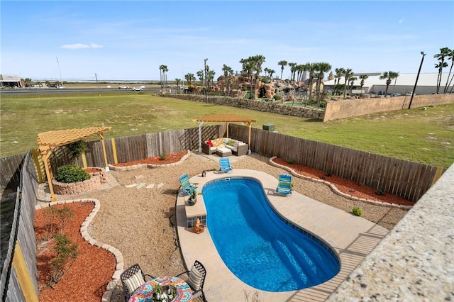 view of swimming pool with a patio area and a yard