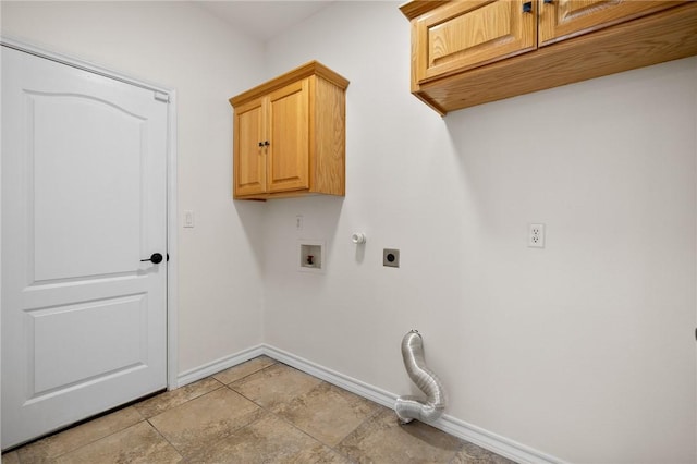 laundry area with hookup for an electric dryer, hookup for a washing machine, and cabinets