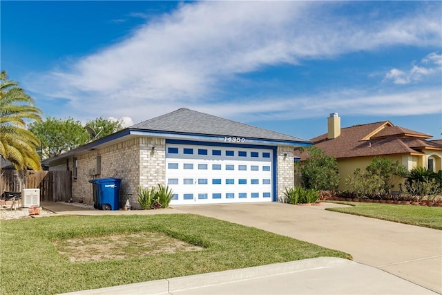 view of front of house with a front lawn and central air condition unit