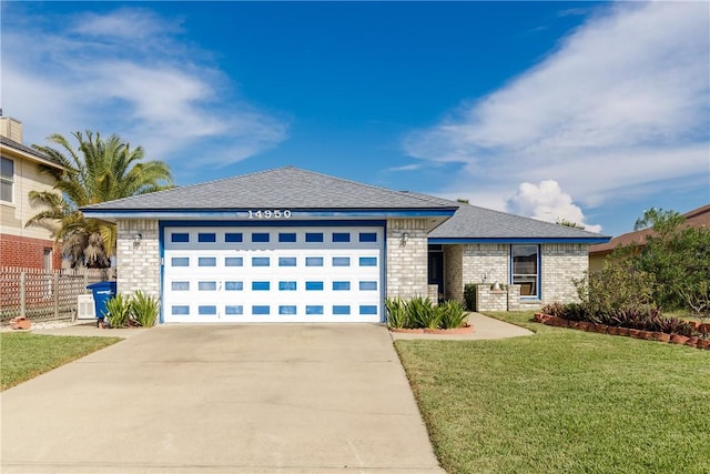 prairie-style house with a front yard and a garage