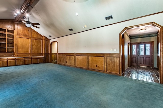 14733 Red River Dr, Corpus Christi, TX 78410 - unfurnished living room with visible vents, a ceiling fan, a wainscoted wall, carpet flooring, and lofted ceiling