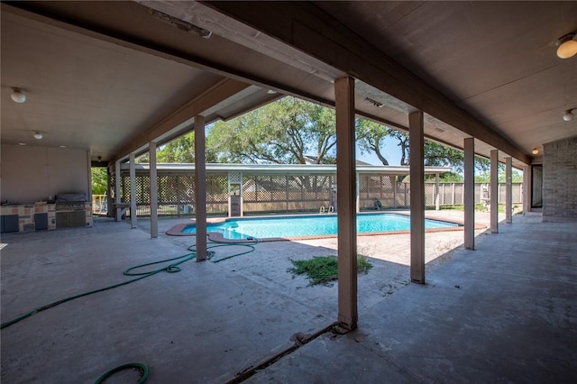 14733 Red River Dr, Corpus Christi, TX 78410 - view of pool featuring an outdoor kitchen, a grill, a patio area, fence, and a fenced in pool