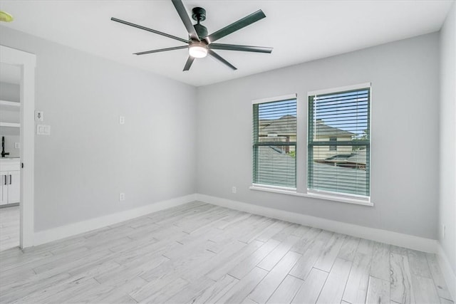 7025 Ashdown Dr, Corpus Christi, TX 78413 - unfurnished room featuring ceiling fan, baseboards, and light wood-style flooring