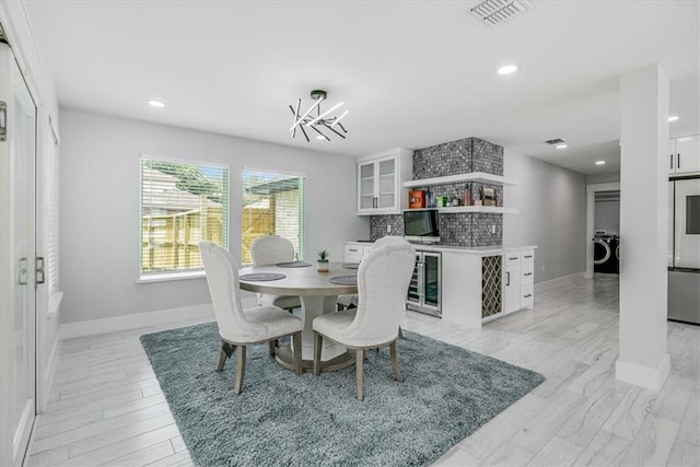 7025 Ashdown Dr, Corpus Christi, TX 78413 - dining room featuring a chandelier, baseboards, washer / dryer, and recessed lighting
