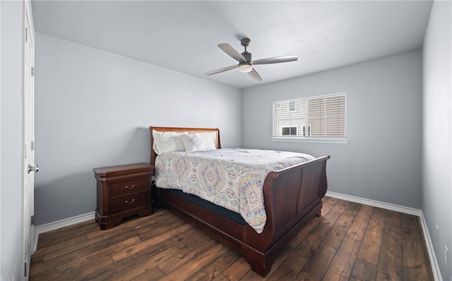 bedroom with dark wood-style floors, baseboards, and a ceiling fan