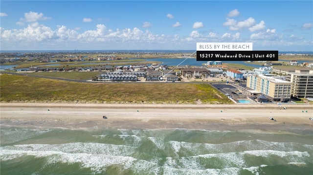 aerial view featuring a water view and a beach view