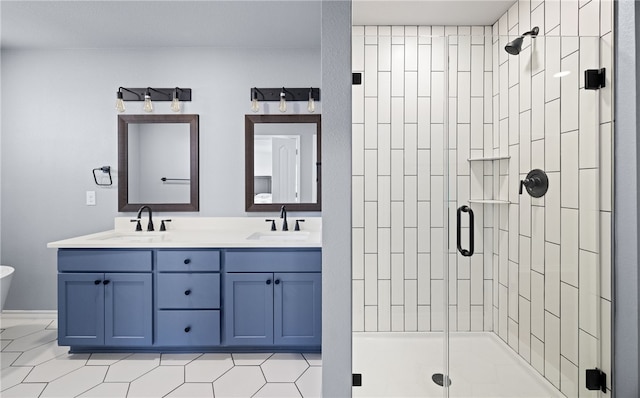 bathroom with double vanity, a sink, and a shower stall