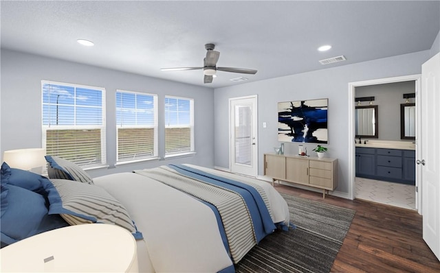 bedroom with recessed lighting, visible vents, dark wood-type flooring, a ceiling fan, and a sink