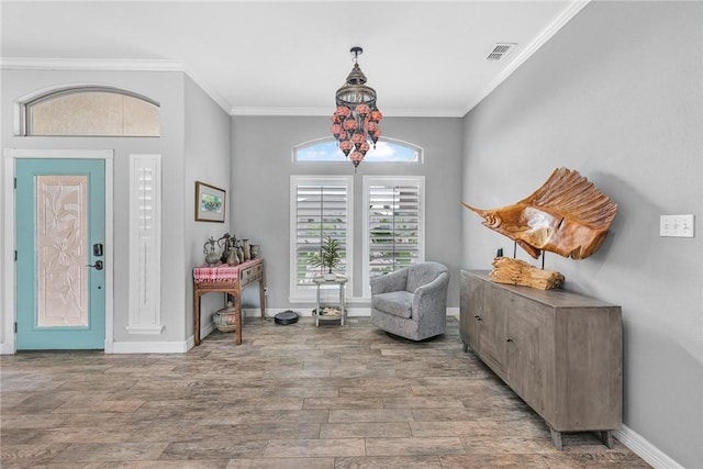 13901 Laffite Dr, Corpus Christi, TX 78418 - entryway featuring ornamental molding and wood finished floors