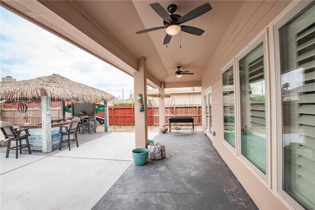 13901 Laffite Dr, Corpus Christi, TX 78418 - fenced backyard featuring a patio and a ceiling fan