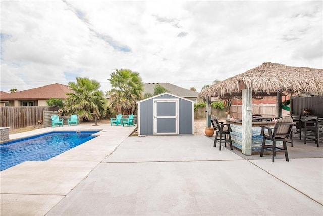 13901 Laffite Dr, Corpus Christi, TX 78418 - view of pool featuring a storage unit, a patio, and a fenced backyard