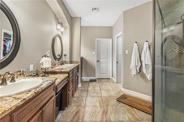 13901 Laffite Dr, Corpus Christi, TX 78418 - bathroom featuring double vanity and a shower stall