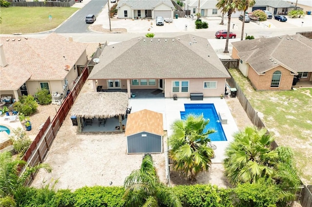 13901 Laffite Dr, Corpus Christi, TX 78418 - view of swimming pool with a residential view, a fenced backyard, and a patio