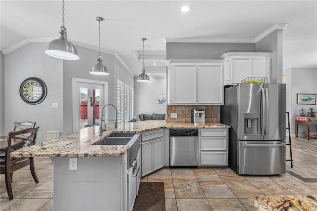 13901 Laffite Dr, Corpus Christi, TX 78418 - kitchen with stainless steel appliances, crown molding, a peninsula, backsplash, and light stone counters