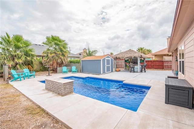 13901 Laffite Dr, Corpus Christi, TX 78418 - view of swimming pool featuring a gazebo, a patio area, a storage shed, and a fenced backyard