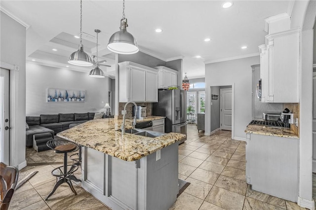 13901 Laffite Dr, Corpus Christi, TX 78418 - kitchen featuring stainless steel appliances, a peninsula, recessed lighting, light stone countertops, and backsplash