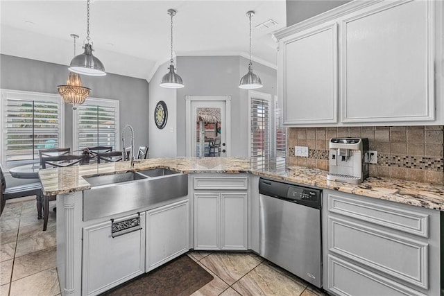 13901 Laffite Dr, Corpus Christi, TX 78418 - kitchen featuring dishwasher, tasteful backsplash, a peninsula, pendant lighting, and vaulted ceiling