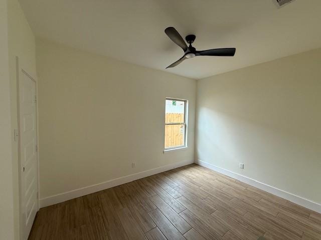 2761 Camargo Dr, Corpus Christi, TX 78415 - empty room with wood finished floors and a ceiling fan