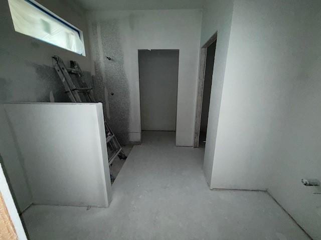 corridor with concrete flooring