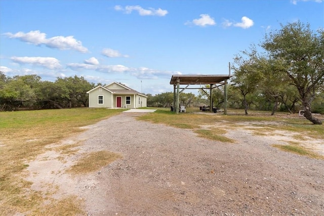 1818 16th St, Rockport, TX 78382 - view of yard with a carport and driveway