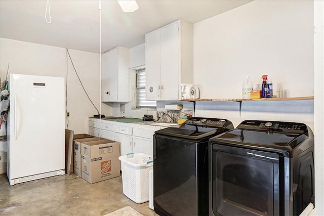 washroom featuring washer and clothes dryer, a sink, and cabinet space