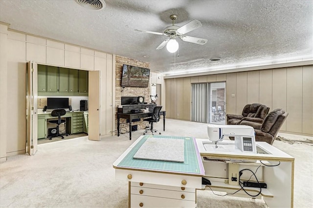 view of patio / terrace with ceiling fan and visible vents