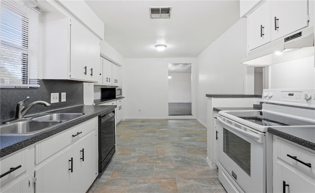 2742 Blue Grass Dr, Corpus Christi, TX 78410 - kitchen with electric range, a sink, dishwasher, stone finish flooring, and dark countertops