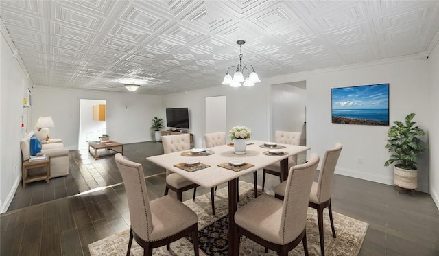 2742 Blue Grass Dr, Corpus Christi, TX 78410 - dining space with an ornate ceiling, baseboards, dark wood-style floors, a chandelier, and crown molding