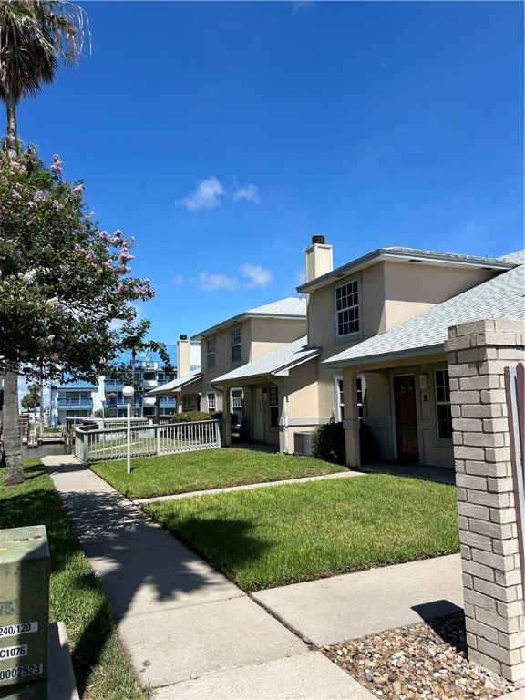 view of side of home featuring a lawn