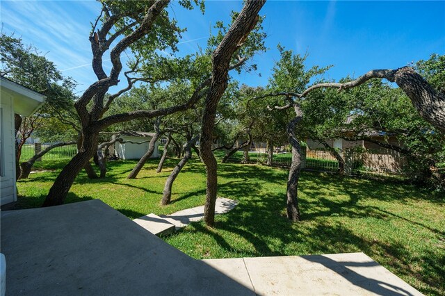 view of home's community with a patio area and a yard