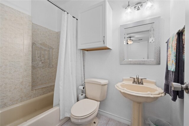 bathroom with toilet, shower / bath combo, and tile patterned floors