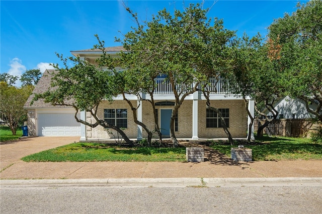 view of front of house with a garage and a balcony