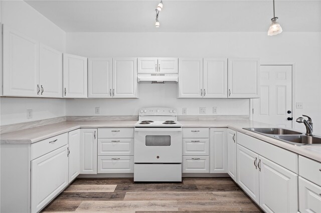 kitchen with white electric range oven, white cabinetry, sink, and pendant lighting