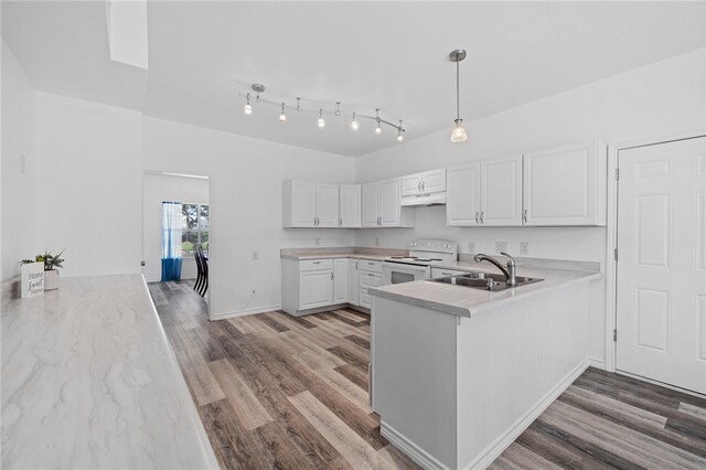 kitchen with white range with electric cooktop, white cabinets, kitchen peninsula, pendant lighting, and light hardwood / wood-style flooring