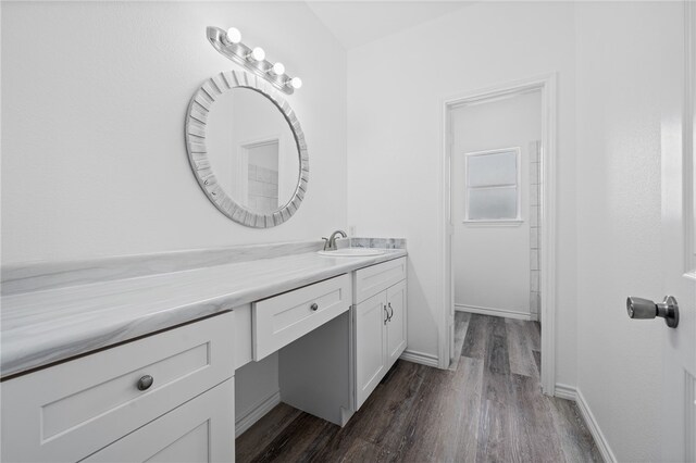 bathroom featuring hardwood / wood-style floors and vanity