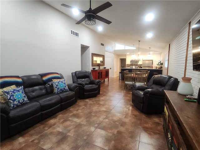 living room with high vaulted ceiling and ceiling fan