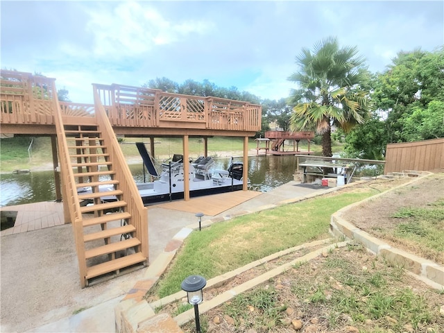 view of dock with a deck with water view