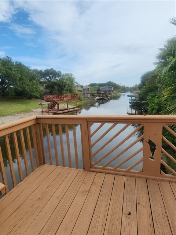 wooden terrace with a water view