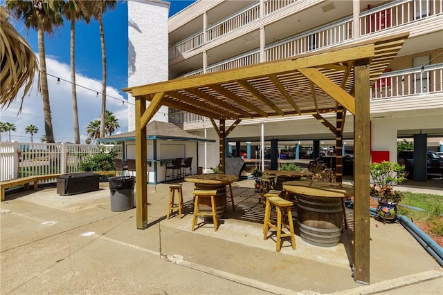 view of patio / terrace with fence and a pergola