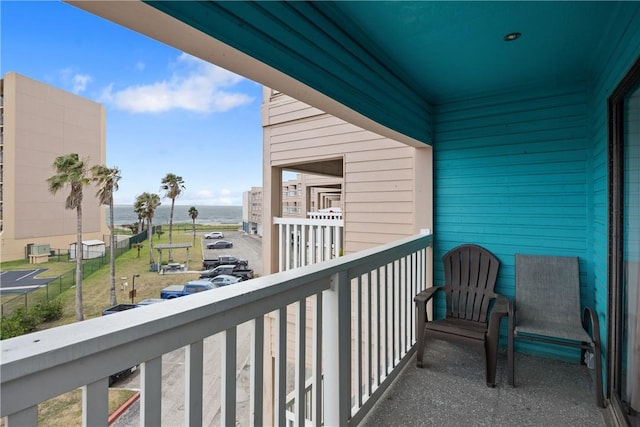 balcony featuring a water view