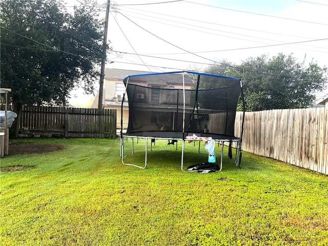 view of yard featuring a trampoline