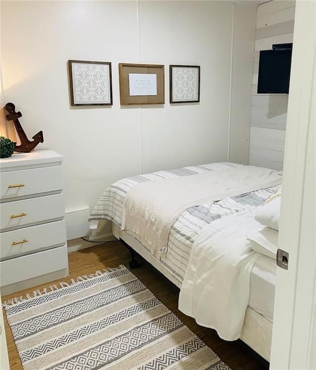 bedroom featuring dark hardwood / wood-style flooring