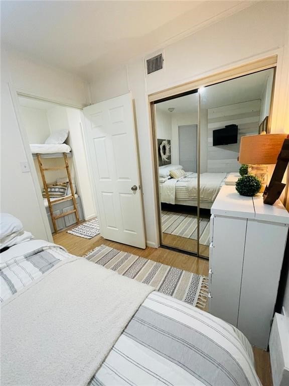 bedroom with a closet and light wood-type flooring