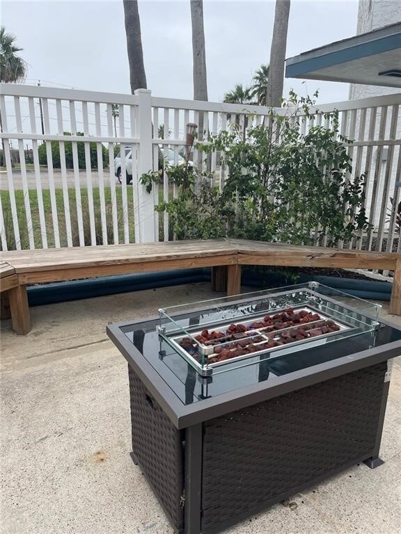 view of patio with an outdoor fire pit