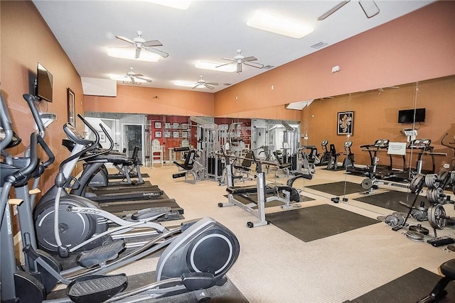 exercise room with ceiling fan