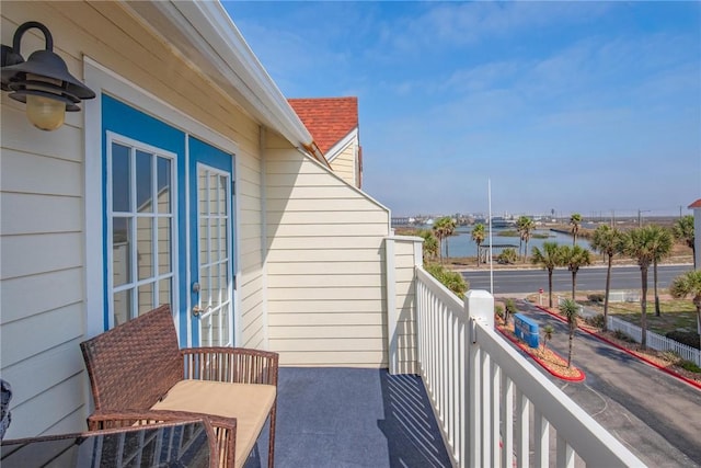 balcony featuring a water view