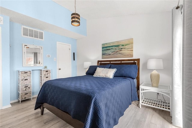 bedroom with hardwood / wood-style floors