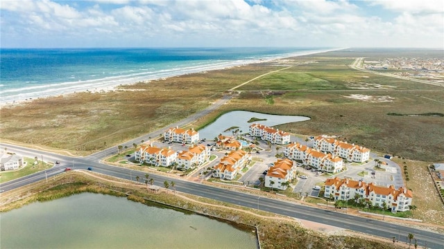 bird's eye view featuring a water view and a view of the beach